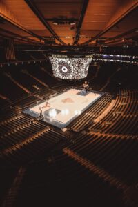 Fans surround the basketball court at Madison Square Garden