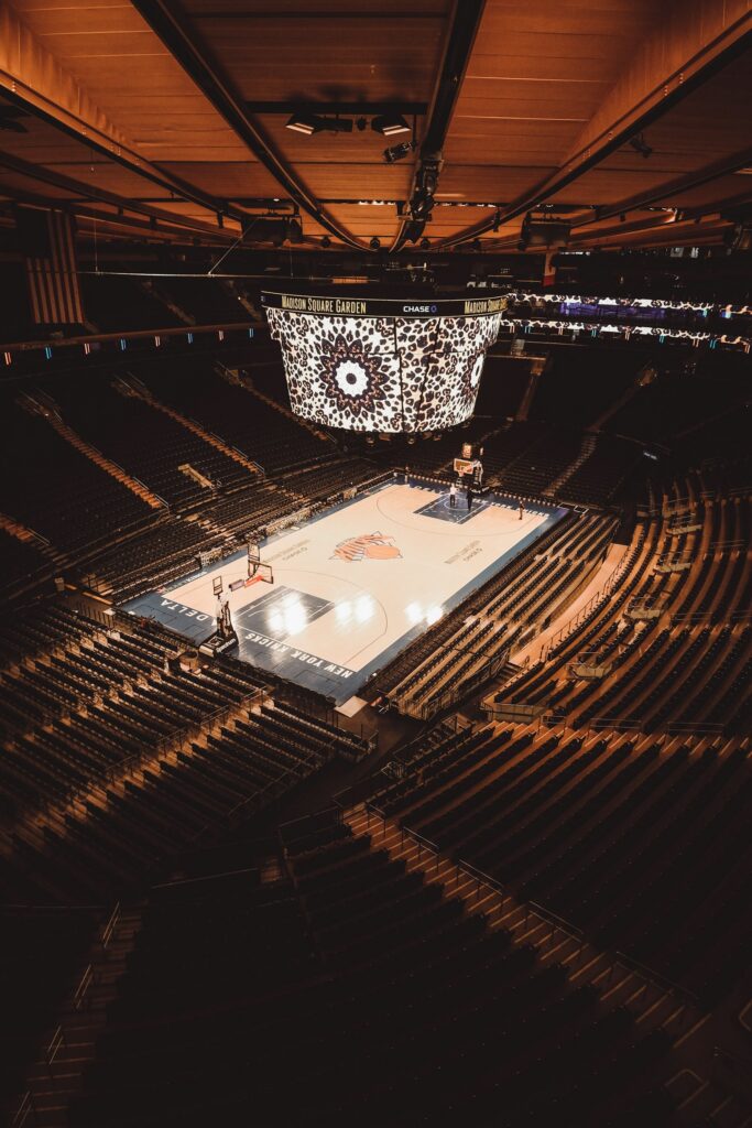 Fans surround the basketball court at Madison Square Garden