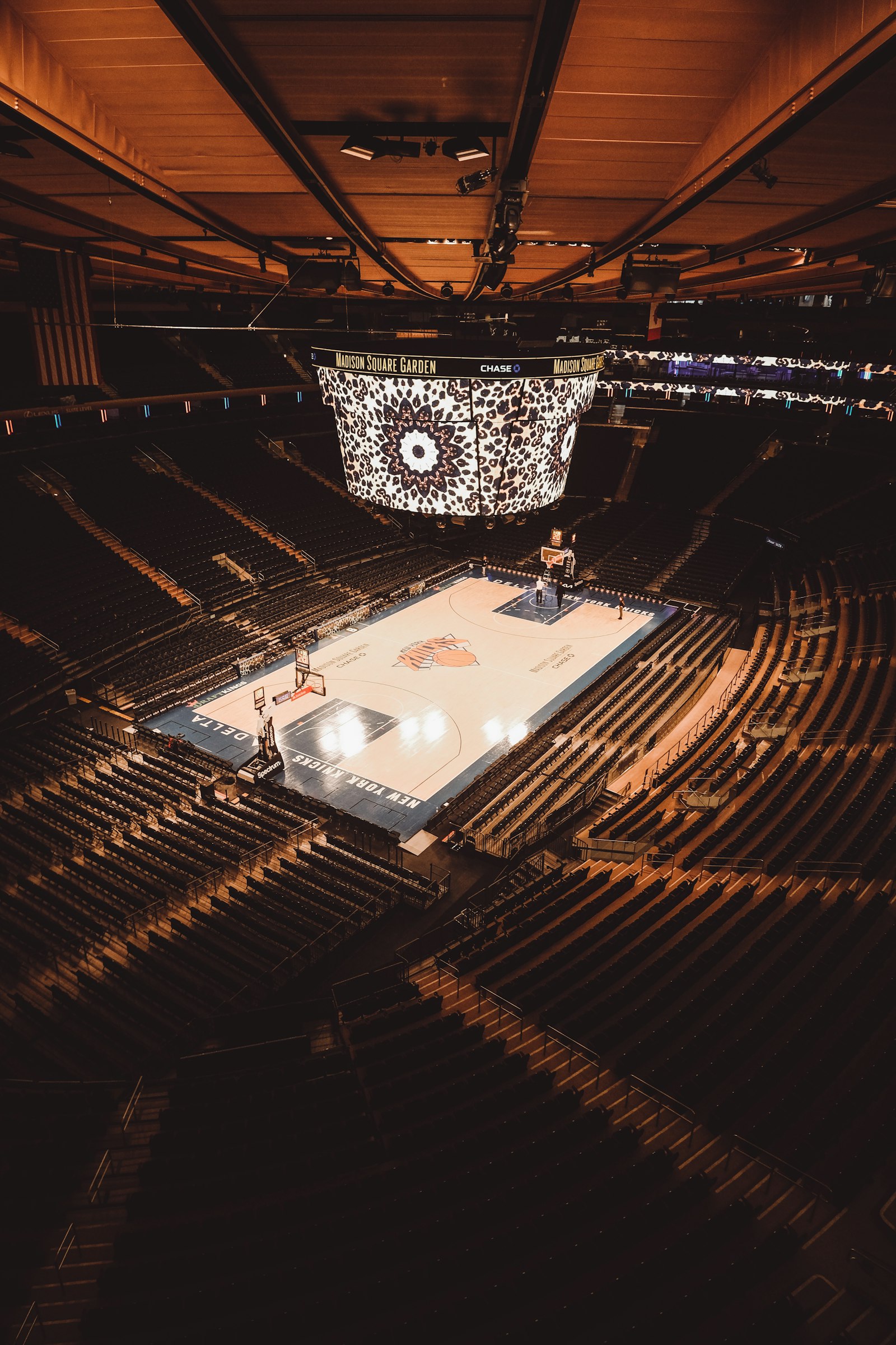 Fans surround the basketball court at Madison Square Garden